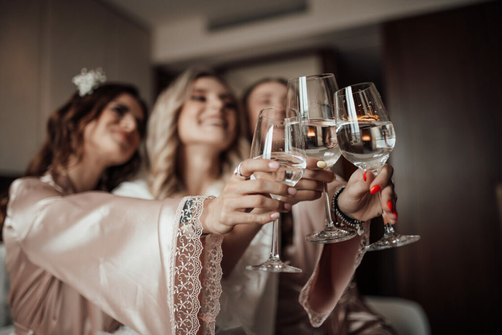 Women holding wine glasses